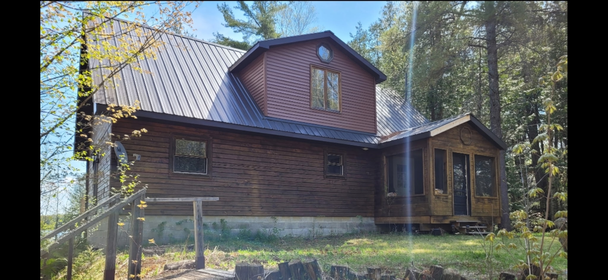 Log home repairs including chinking, rot removal, and staining